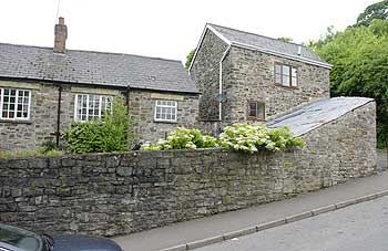 Random stone finish prior to over cladding with